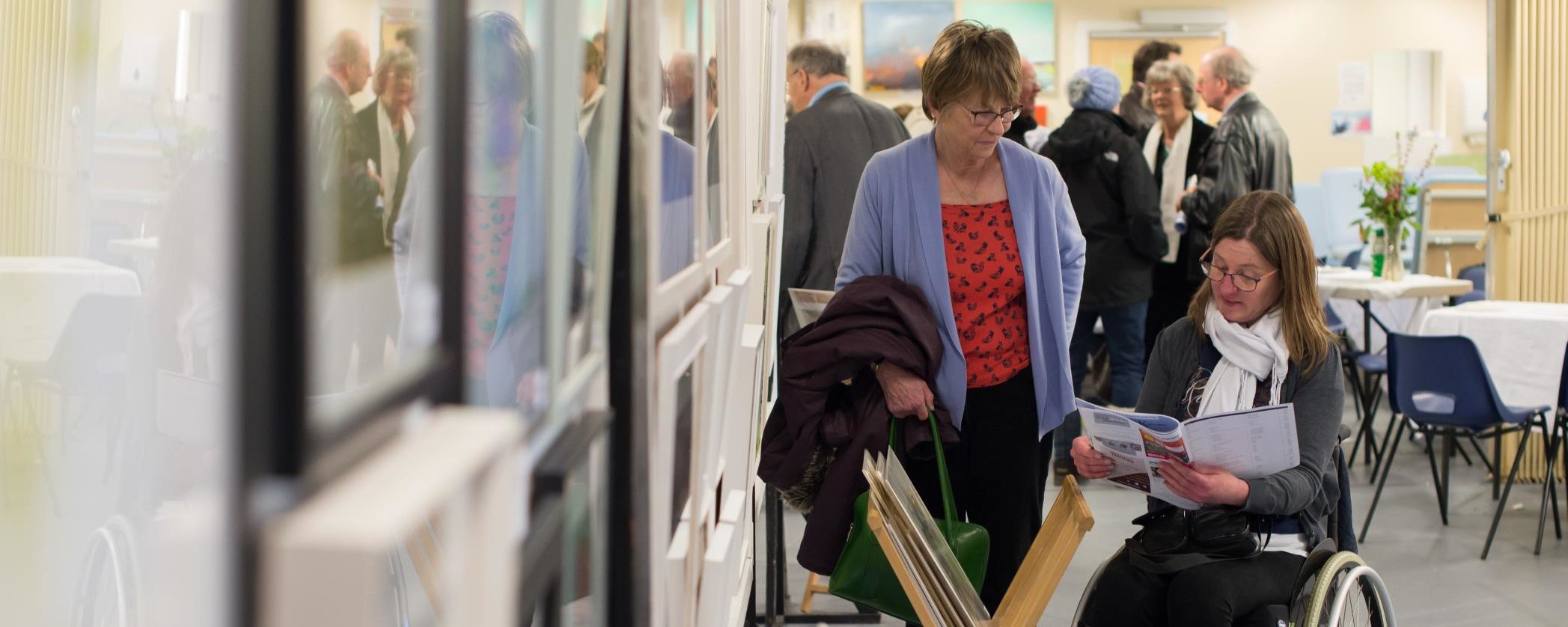 One of our members looking through the art catalogue