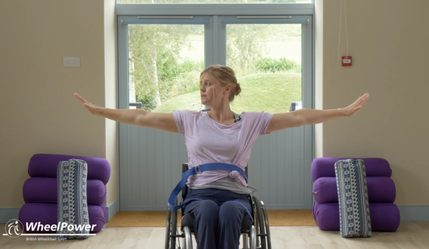 a woman doing yoga in a wheelchair