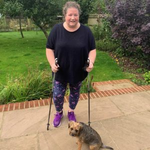 sarah with her dog and nordic walking sticks