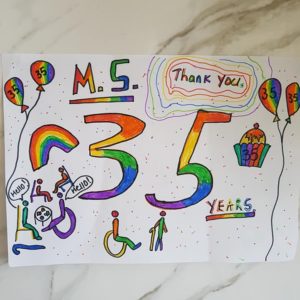 A rainbow sign saying MS 35 years