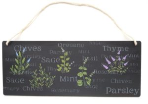Hand painted herbs pictures and words on black wall hanging.