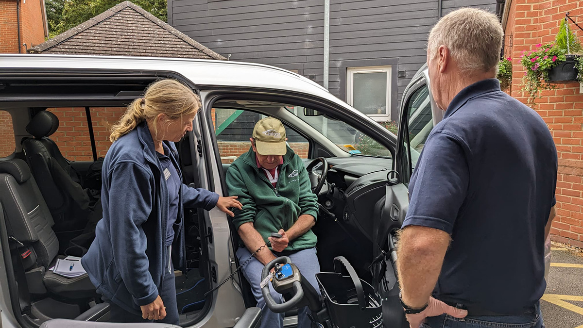  Wendy Valentine and Jeff Adams demonstrating some vehicle adaptations to a member of the Centre.