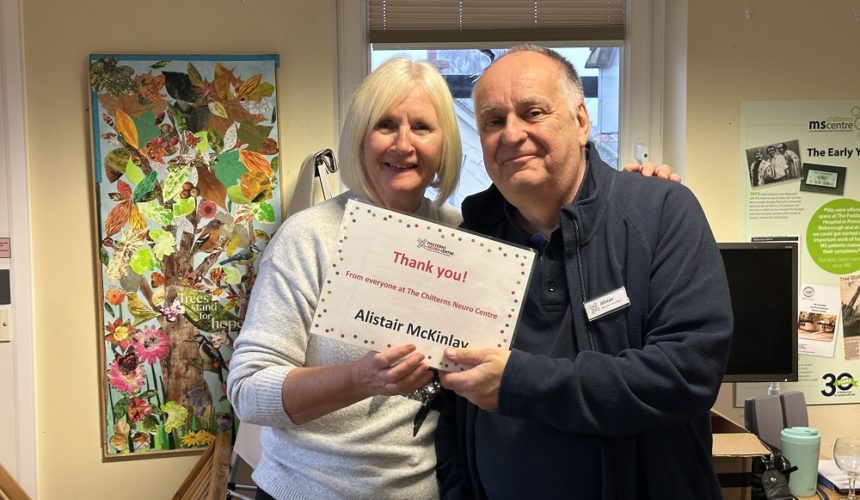 Alistair McKinlay being presented his Volunteer Award certificate by Cathy Garner.