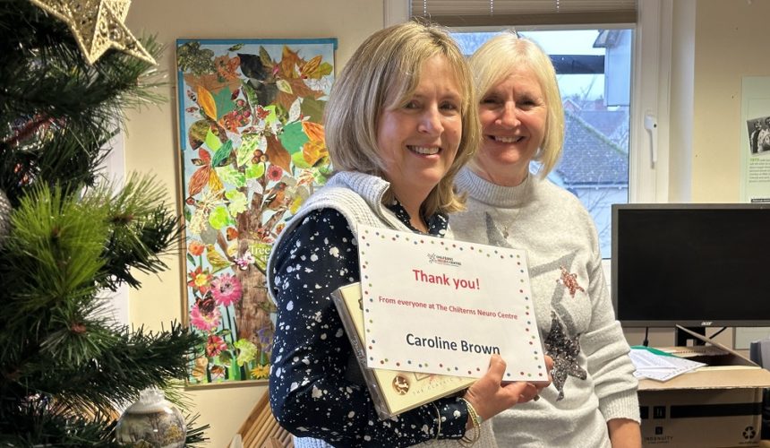 Caroline Brown being presented her Volunteer Award certificate by Cathy Garner.