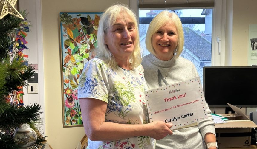 Carolyn Carter being presented her Volunteer Award certificate by Cathy Garner.