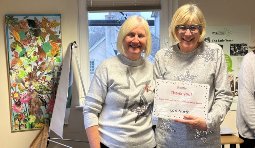 Lori North being presented her Volunteer Award certificate by Cathy Garner.