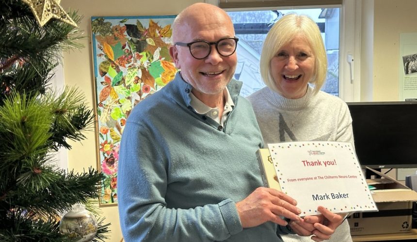 Mark Baker being presented his Volunteer Award certificate by Cathy Garner.