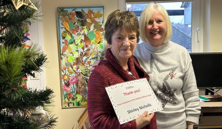 Shirley Nicholls being presented her Volunteer Award certificate by Cathy Garner.